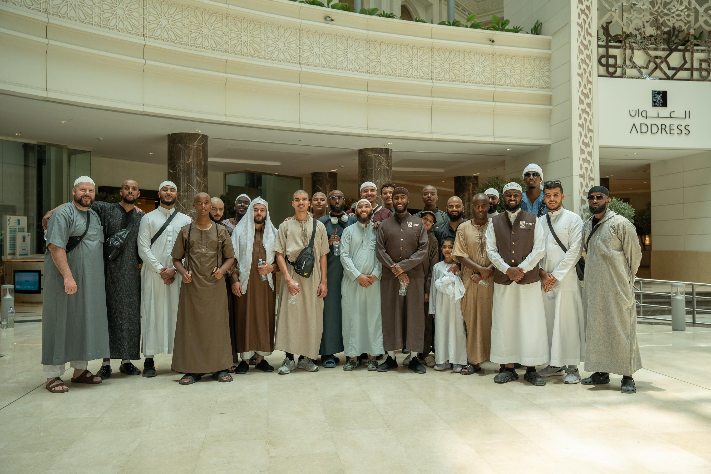 Rawdah Tours pilgrims gathered for a group photo in Makkah